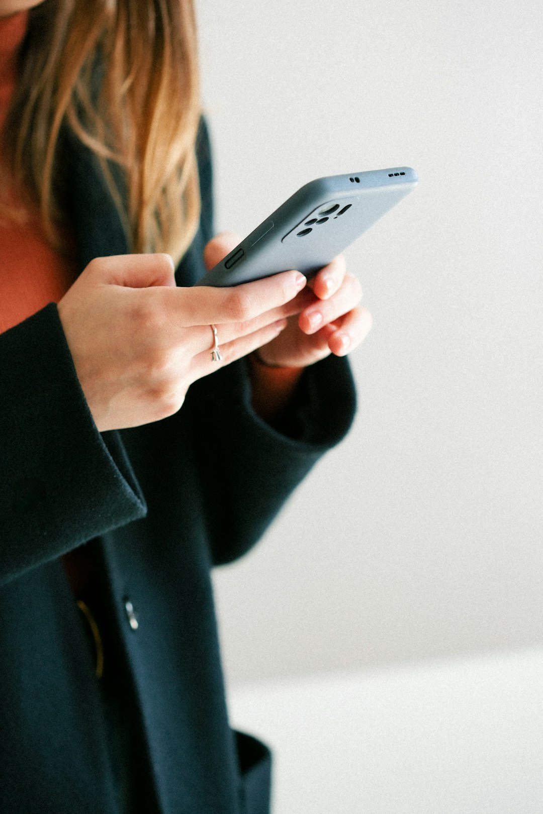 Woman using health app on phone at home