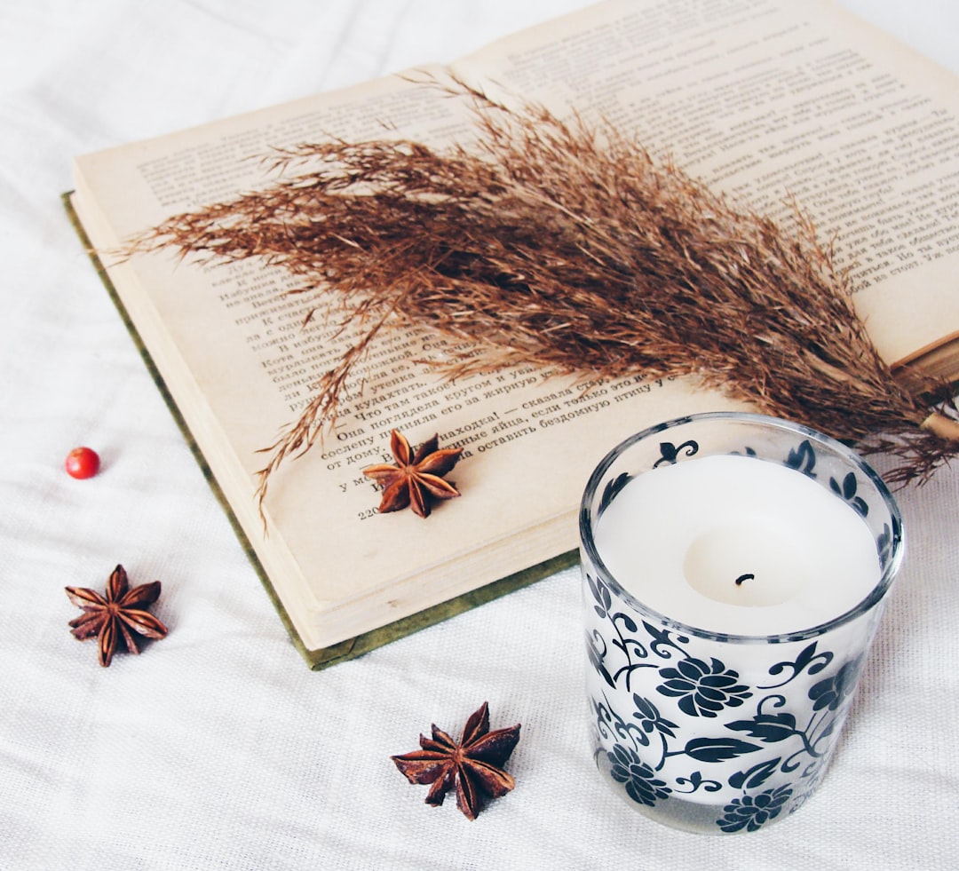 Self-care still life with candle and flowers
