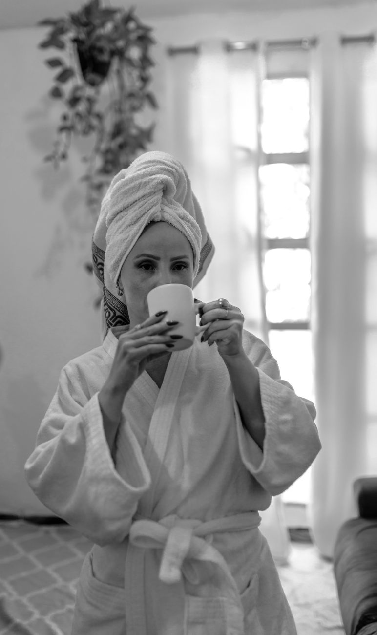 Woman relaxing at home with morning coffee, self-care moment